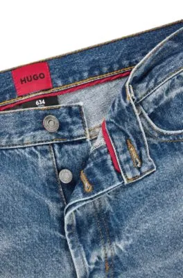 Vaqueros tapered fit de denim rígido azul
