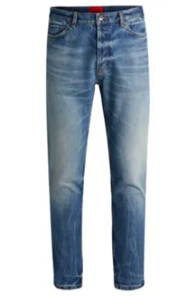 Vaqueros tapered fit de denim rígido azul